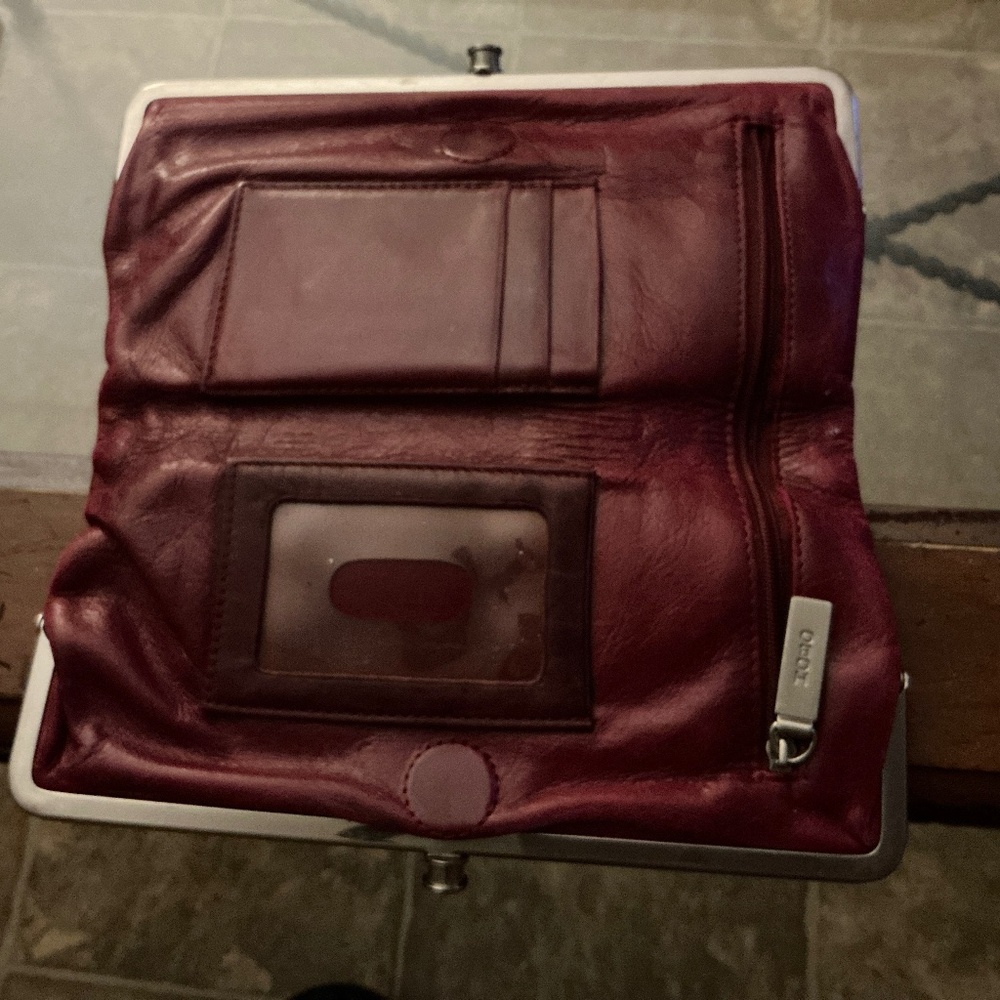 HOBO Clutch burgundy leather and in good pre owned condition.